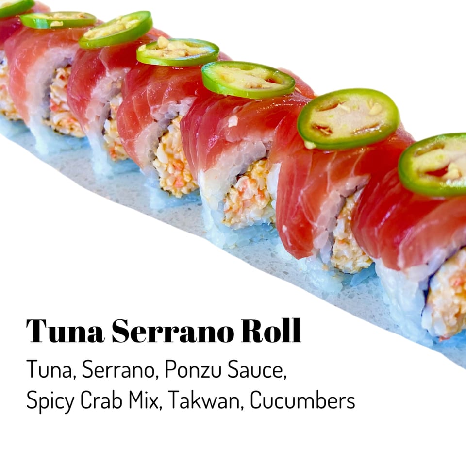 Sushi Friend's Tuna Serrano Roll, topped with bright green serrano pepper slices, on a white background.